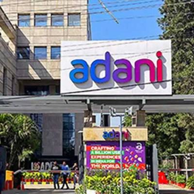 Adani group aims to raise Rs 210 bn through stake sale in two companies