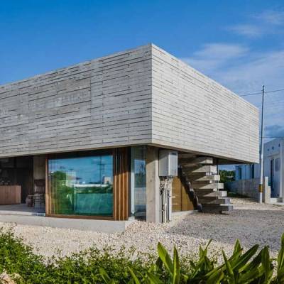 IGArchitects’ one-legged house supported on single concrete column